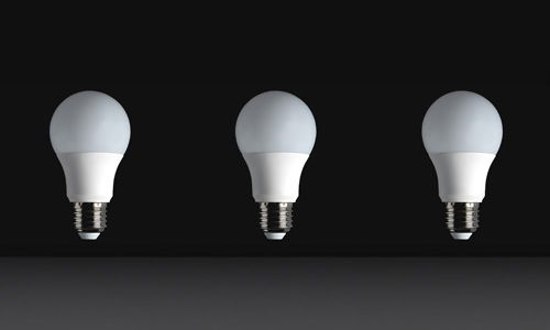 Three LED Bulbs on a black background switched off