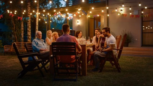 Outdoor Gathering Between People at a Table
